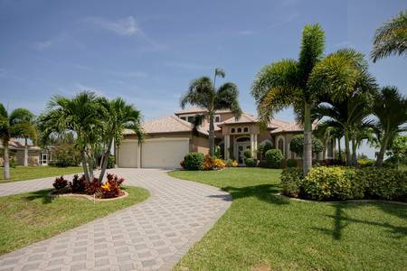 Slideshow of vacation rental property Immaculate 5 bedroom plus den 3 car garage gulf access pool home! in Cape Coral